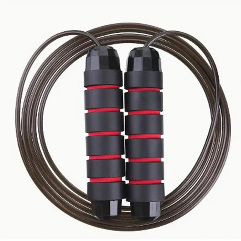 A professional tangle-free speed jump rope with foam handles and a durable steel cable, designed for rapid speed, agility training, and full-body workouts, displayed on a gym floor.