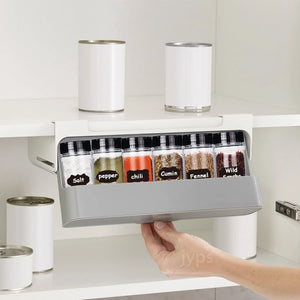 Wall-mounted under-shelf spice rack with pull-out compartment for organizing up to seven spice jars, featuring durable food-grade materials and drill-free 3M adhesive installation for modern kitchens.