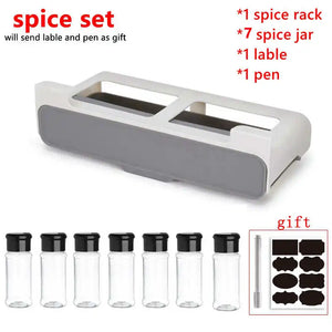 Wall-mounted under-shelf spice rack with pull-out compartment for organizing up to seven spice jars, featuring durable food-grade materials and drill-free 3M adhesive installation for modern kitchens.