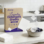Compact laundry detergent sheets packed with clothing for convenient travel laundry.